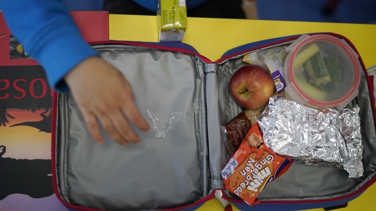 ALTRINCHAM, ENGLAND - APRIL 08:  Children of key workers eat their packed lunches as attend school activities at Oldfield Brow Primary School on April 08, 2020 in Altrincham, England. The government announced the closure of UK schools from March 20 except for the children of key workers, such as NHS staff, and vulnerable pupils, such as those looked after by local authorities. The prime minister has said schools will remain closed "until further notice," and many speculate they may not reopen until next term. (Photo by Christopher Furlong/Getty Images)