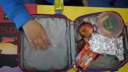 ALTRINCHAM, ENGLAND - APRIL 08:  Children of key workers eat their packed lunches as attend school activities at Oldfield Brow Primary School on April 08, 2020 in Altrincham, England. The government announced the closure of UK schools from March 20 except for the children of key workers, such as NHS staff, and vulnerable pupils, such as those looked after by local authorities. The prime minister has said schools will remain closed "until further notice," and many speculate they may not reopen until next term. (Photo by Christopher Furlong/Getty Images)