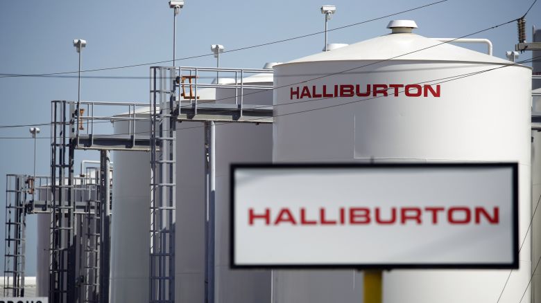 Halliburton Co. signage is displayed alongside storage tanks in Port Fourchon, Louisiana, U.S., on Thursday, June 11, 2020. Oil eclipsed $40 a barrel in New York on Friday, extending a slow but relentless rise thats been fueled by a pick-up in demand and could signal a reawakening for U.S. shale production. Photographer: Luke Sharrett/Bloomberg via Getty Images