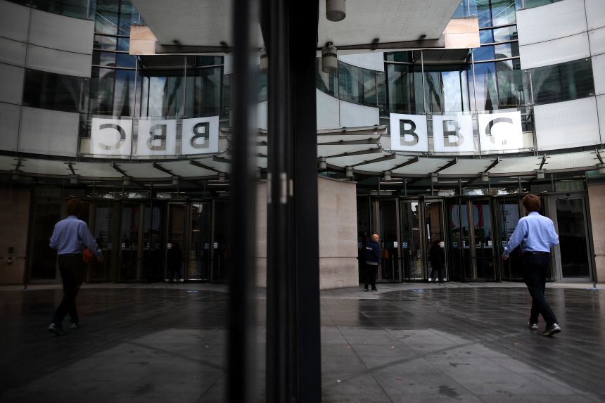 A man walks outside the BBC headquarters in London on July 2, 2020.