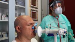 GENOA, ITALY - JULY 22: A recovered Coronavirus patient is tested at the Department of Rehabilitative Cardiology of ASL 3 Genova on July 22, 2020 in Genoa, Italy. There is an estimated 14 million confirmed Coronavirus cases worldwide, with a reported 8 million recovering patients. In 80 percent of COVID-19 cases, recovery is complicated, leaving physical and psychological consequences that do not easily subside or allow survivors to return to normal life. The first Covid veterans gym, a project of Genoa's ASL 3 and rehabilitation cardiology department directed by cardiologist Piero Clavario, aims to address this. Designed to reactivate the heart, muscles and lungs, the gyms rehabilitation process gives patients a 2-month protocol, overseen by a staff of four doctors, three nurses, one psychologist and a physiotherapist. Of approximately 700 patients who were previously hospitalized with Covid, 100 patients were selected to participate in the gym, with the first 12 patients now six weeks into their rehabilitation process. Treatment is designed to combat numerous effects of the disease. Half of all patients hospitalized for Covid will be left with lung fibrosis, causing difficulty breathing. The nervous system is also affected as evidenced by the loss of taste and smell. Meanwhile 80 percent of patients suffer cognitive impairments such as memory loss and orientation difficulties, 40 percent show symptoms of depression and others experience chronic fatigue and rapid weight loss. (Photo by Marco Di Lauro/Getty Images)