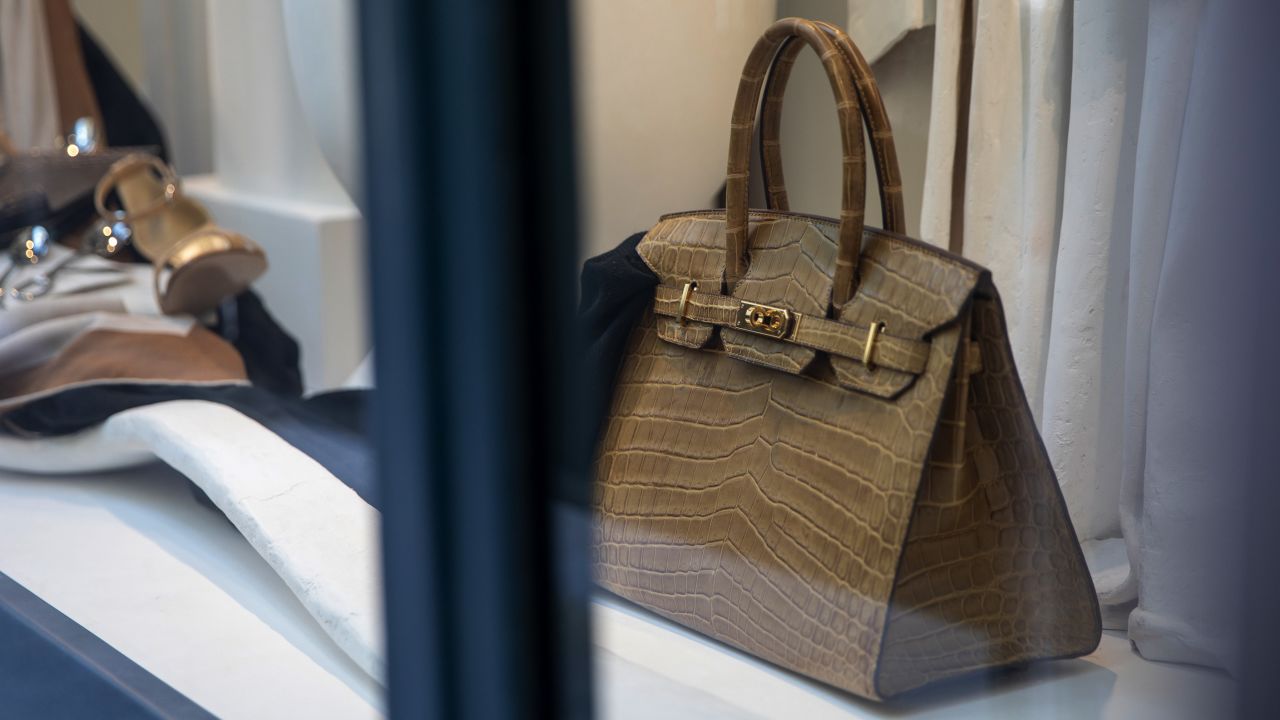 A Birkin luxury handbag sits in the window display of a Hermes International store in Paris, France, on Tuesday, July 28, 2020.