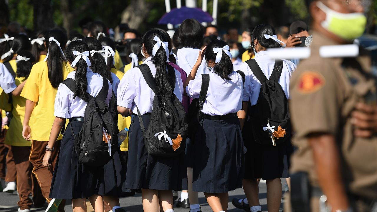 Students in uniform from multiple school wearing white ribbons and make the three-finger salute rally in front of Education Ministry calling the ouster of the education minister and the prime minister to step down on August 19, 2020 in Bangkok, Thailand. (Photo by Vachira Vachira/NurPhoto via Getty Images)