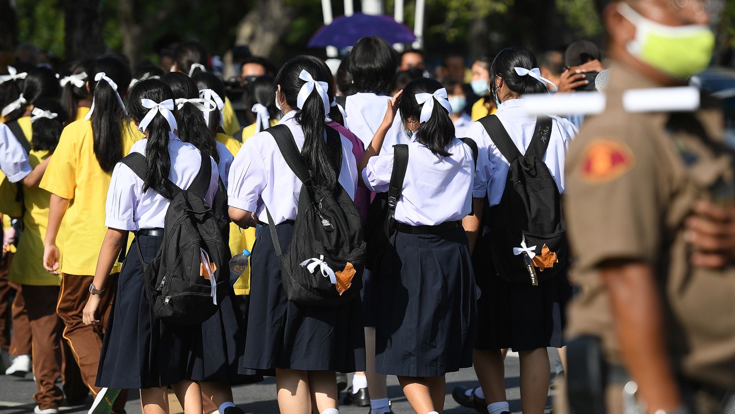 Students wearing the standard Thai school uniform and white ribbons in their hair as a sign of protest in Bangkok, Thailand, on August 19, 2020.