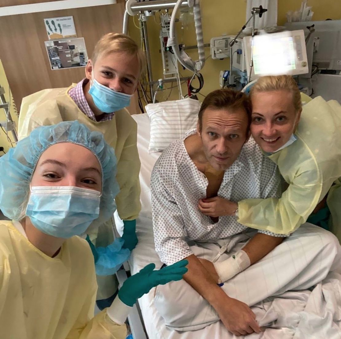 A photo shared on Navalny's instagram account shows the Russian opposition leader in a hospital bed surrounded by his wife and two children as his treatment continues following novichok poisoning in 2020. 