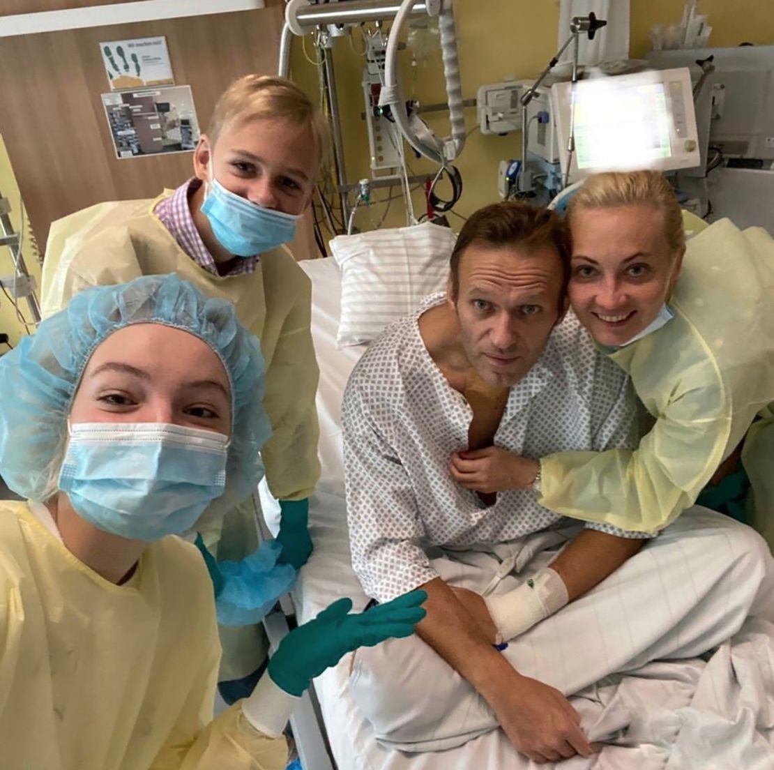 A photo shared on Navalny's instagram account shows the Russian opposition leader in a hospital bed surrounded by his wife and two children as his treatment continues following novichok poisoning in 2020.