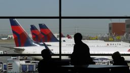 Travelers wait for flights as Delta Air Lines planes sit at gates on opening day of the Salt Lake City International Airport in Salt Lake City, Utah, U.S., on Tuesday, Sept. 15, 2020.