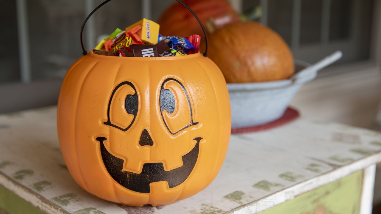 Halloween candy is displayed inside a pumpkin themed treat bucket in Tiskilwa, Illinois, in 2020.