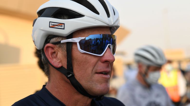 US former professional cyclist Lance Armstrong stands as he prepares to ride with Dubai cyclists at the al-Qudra Cycling Tracks in Dubai desert on October 6, 2020 during for a four-day work trip to the Emirates. (Photo by Karim SAHIB / AFP) (Photo by KARIM SAHIB/AFP via Getty Images)