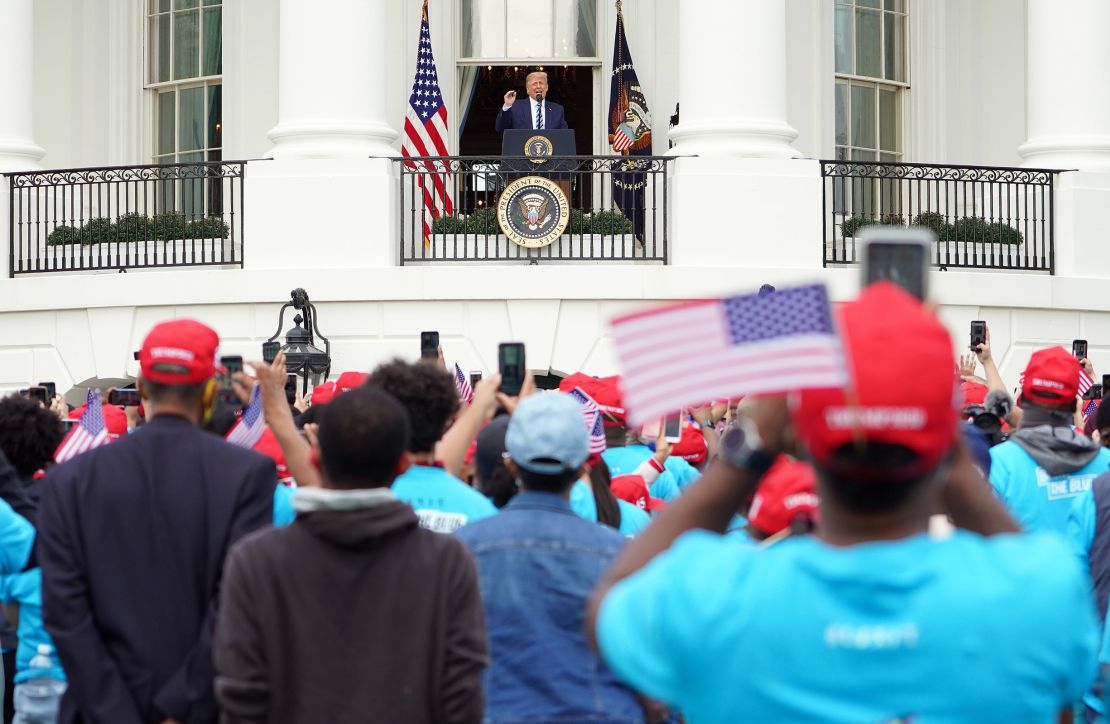 Then-President Donald Trump speaks to supporters at White House on October 10, 2020. The speech was his first public address since he'd tested positive for Covid-19.