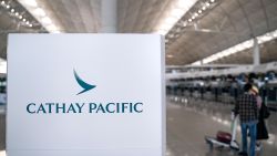 HONG KONG, CHINA - OCTOBER 21: Signage of Hong Kong airline Cathay Pacific is displayed near check-in counter at the Hong Kong International Airport on October 21, 2020 in Hong Kong, China. Hong Kong airline Cathay Pacific Airways has announced it will cut 8,500 jobs and shut down its regional airline unit, Cathay Dragon, in a corporate restructuring, as it grapples with the plunge in air travel due to the pandemic. (Photo by Anthony Kwan/Getty Images)