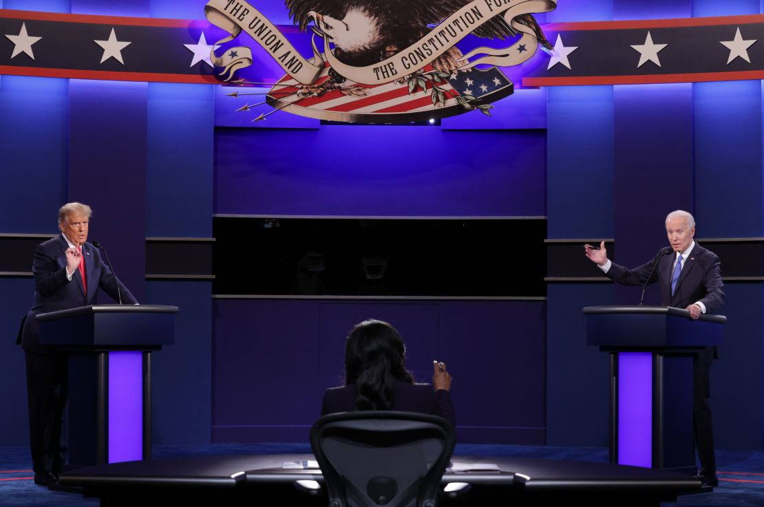 Then-President Donald Trump and then-Democratic presidential candidate and former US Vice President Joe Biden and moderator NBC News anchor Kristen Welker participate in a debate at Belmont University in Nashville, Tennessee, on October 22, 2020.