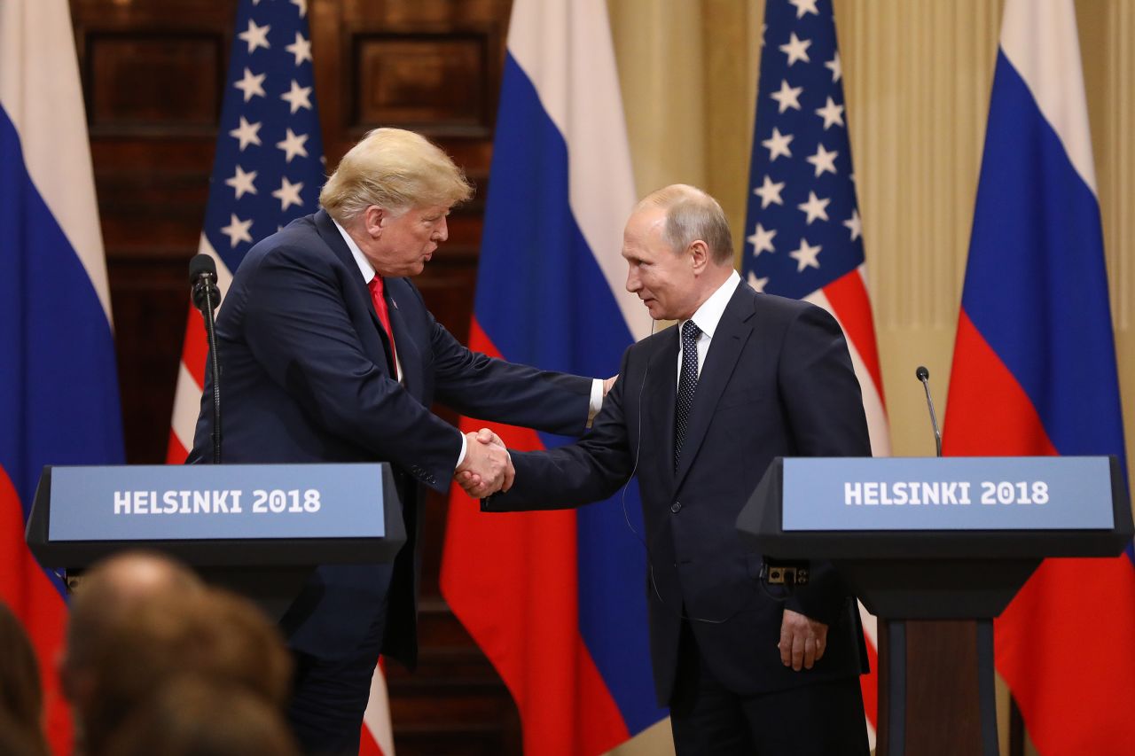 US President Donald Trump, left, shakes hands with Russian President Vladimir Putin during a news conference in Helsinki, Finland, on July 16, 2018.