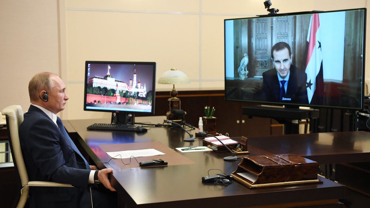 TOPSHOT - Russian President Vladimir Putin holds a meeting with his Syrian counterpart Bashar al-Assad via a video conference call at the Novo-Ogaryovo state residence outside Moscow on November 9, 2020. (Photo by Alexey NIKOLSKY / SPUTNIK / AFP) (Photo by ALEXEY NIKOLSKY/SPUTNIK/AFP via Getty Images)