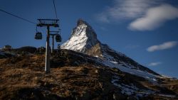 This picture taken on November 28, 2020 shows gondolas next to the Matterhorn above the resort of Zermatt in the Swiss Alps. (Photo by Fabrice COFFRINI / AFP) (Photo by FABRICE COFFRINI/AFP via Getty Images)