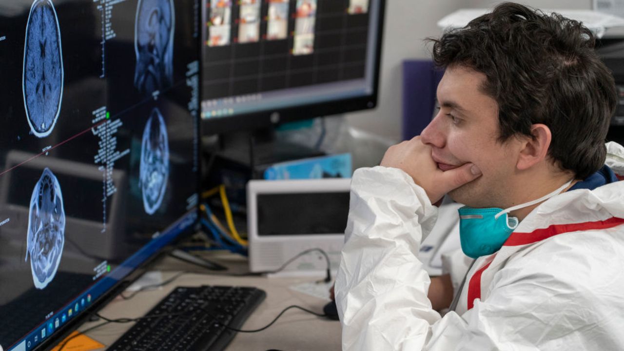 HOUSTON, TX - DECEMBER 10:  (EDITORIAL USE ONLY) A medical staff member Gabriel Cervera Rodriguez watches a screen which shows a patient's MRI images at nursing station in the COVID-19 intensive care unit (ICU) at the United Memorial Medical Center on December 10, 2020 in Houston, Texas. According to reports, Texas has reached over 1,390,000 cases, including over 23,700 deaths. (Photo by Go Nakamura/Getty Images)