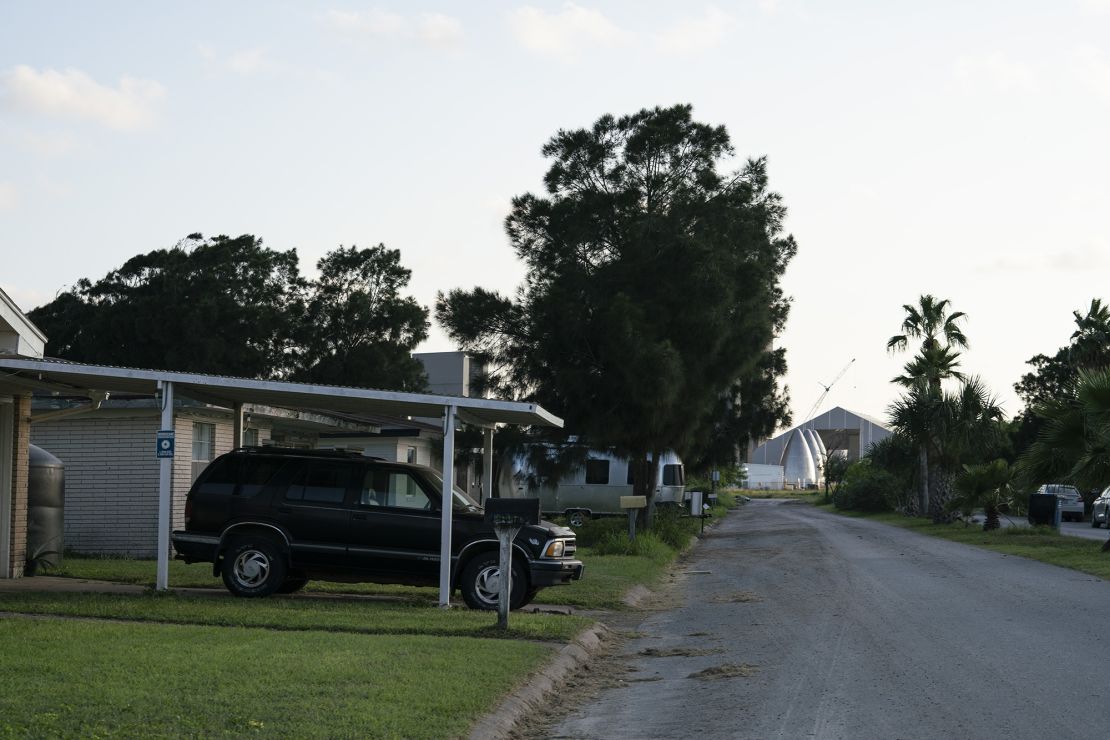 A vehicle sits parked outside a home that lies adjacent to SpaceX's rocket manufacturing facilities near the company's South Texas launch site. The neighborhood is less than 2 miles from Boca Chica Beach.