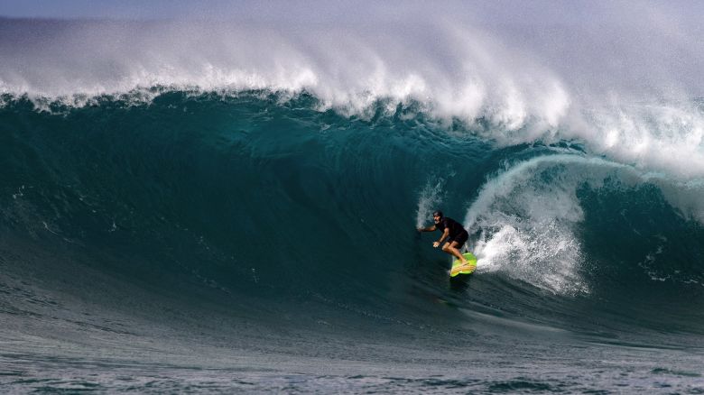 Surfer Garrett McNamara of the US rides a wave on December 29, 2020, during practice at Sunset Beach in Pupukea, Oahu, Hawaii. - Pro surfers are getting ready for the beginning of the 2021 World Surfing League championship season in January. (Photo by Brian Bielmann / AFP) / RESTRICTED TO EDITORIAL USE (Photo by BRIAN BIELMANN/AFP via Getty Images)
