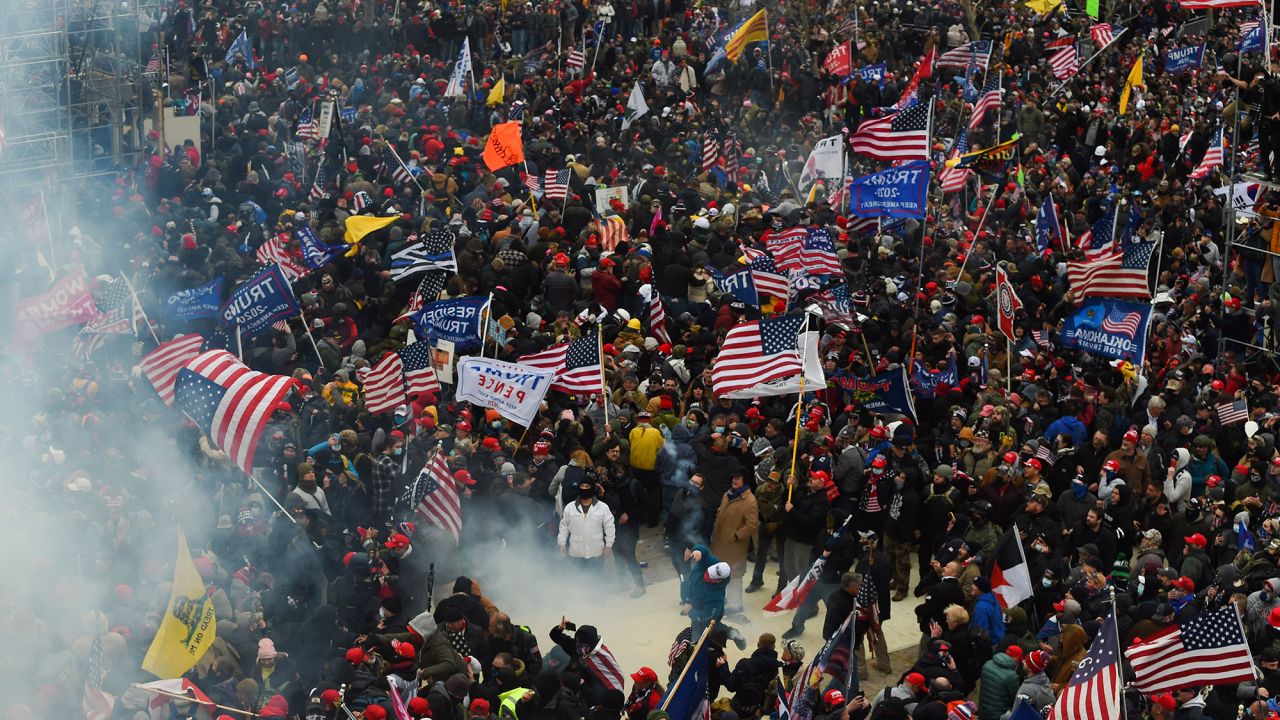 Trump supporters clash with police and security forces as they storm the US Capitol in Washington D.C on January 6, 2021. Demonstrators breeched security and entered the Capitol as Congress debated the a 2020 presidential election Electoral Vote Certification.