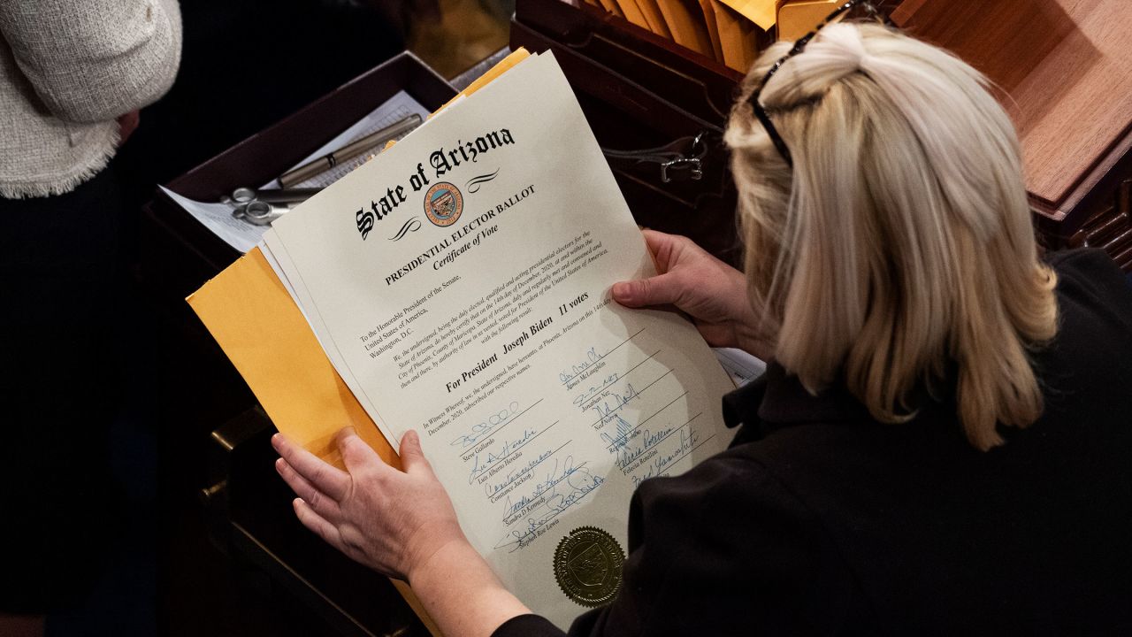 This January 6, 2021 photo shows congressional aides preparing Arizona's Electoral College votes to be certified during a joint session of Congress in the House chamber in Washington, DC. 