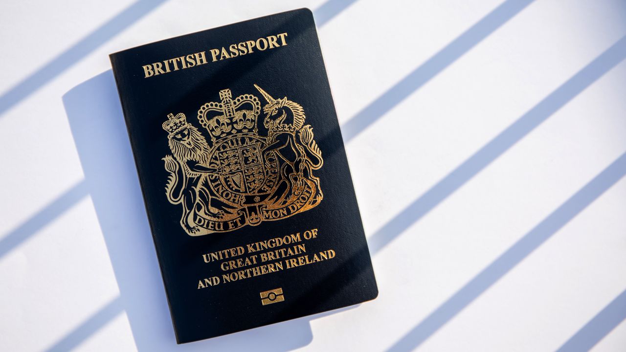 A copy of the British National (Overseas) passport arranged in Hong Kong, China, on Saturday, Jan. 30, 2021. Prime Minister Boris Johnson estimates about 300,000 Hong Kong citizens will take advantage of a new visa route to leave the former British colony and settle in the U.K., despite nearly three million people being eligible. Photographer: Paul Yeung/Bloomberg via Getty Images