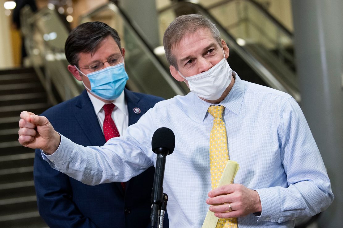 Reps. Jim Jordan, right, and Mike Johnson speak with reporters in the Senate subway after the first day of the impeachment trial of former President Donald Trump in the Capitol in Washington, DC, on February 9, 2021.