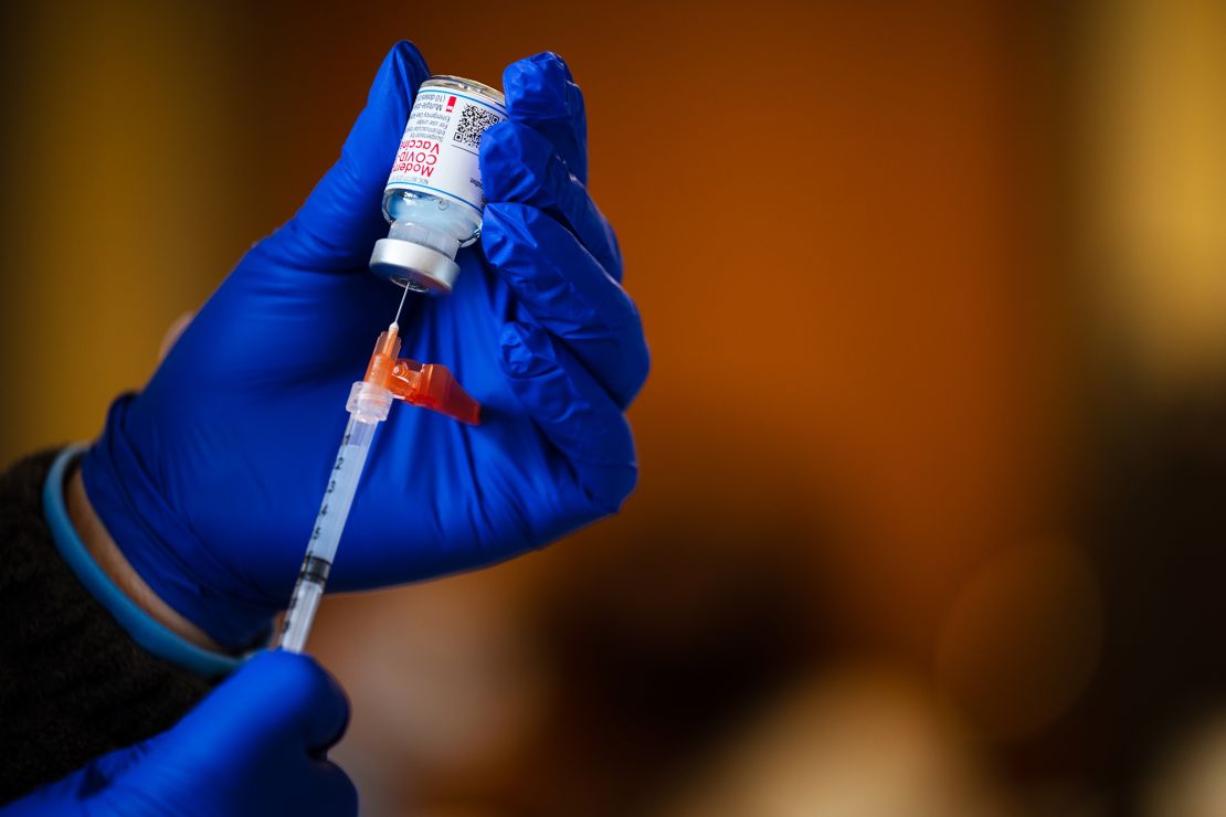 A medical technician fills a syringe from a vial of the Moderna COVID-19 vaccine in Bates Memorial Baptist Church February 12, 2021 in Louisville, Kentucky.