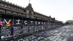 MEXICO CITY, MEXICO - MARCH 08: Names of feminicide victims, slogans and flowers intervene fences placed outside the National Palace ahead of demostrations as part of the International Women's Day on March 8, 2021 in Mexico City, Mexico. (Photo by Karen Melo/Getty Images)