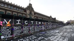 MEXICO CITY, MEXICO - MARCH 08: Names of feminicide victims, slogans and flowers intervene fences placed outside the National Palace ahead of demostrations as part of the International Women's Day on March 8, 2021 in Mexico City, Mexico. (Photo by Karen Melo/Getty Images)