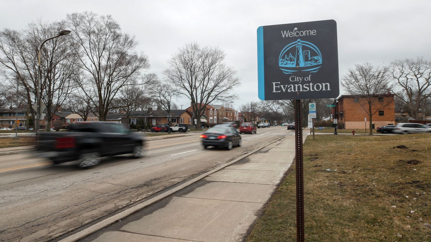 Cars drive past a sign welcoming people to the city of in Evanston, Illinois, on March 16, 2021. A conservative legal group is challenging the constitutionality of the city's reparations program.