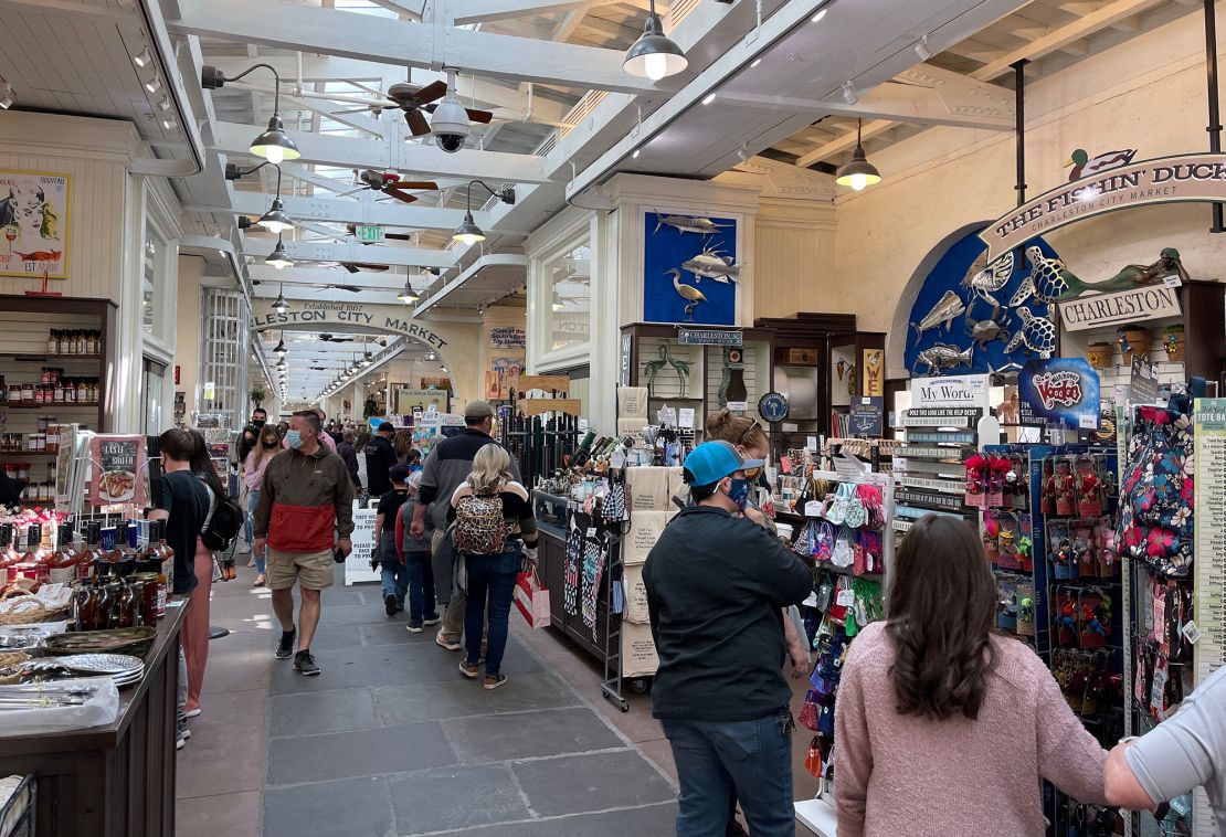 People shop in the historic Charleston City Market, South Carolina, in 2021.