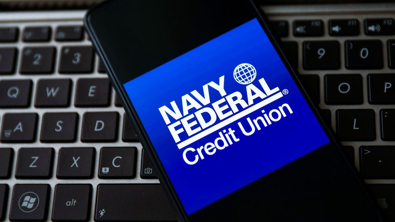 Navy Federal Credit Union logo is displayed on a mobile phone screen in April 2021.