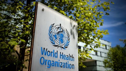 A picture taken on May 8, 2021 shows a sign of the World Health Organization (WHO) at the entrance of their headquarters in Geneva amid the Covid-19 coronavirus outbreak. (Photo by Fabrice COFFRINI / AFP) (Photo by FABRICE COFFRINI/AFP via Getty Images)