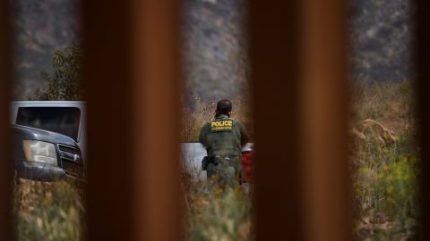 A US Border Patrol agent patrols new sections of the steel bollard-style border wall along the US-Mexico border between San Diego and Tijuana, during a tour with the US Customs and Border Protection on May 10, 2021, in the Otay Mesa area of San Diego County, California. - Few issues have as long a history of bedeviling both Democrats and Republicans as immigration and asylum on the approximately 2,000-mile (3,000-kilometer) US-Mexico frontier. (Photo by Patrick T. FALLON / AFP) (Photo by PATRICK T. FALLON/AFP via Getty Images)
