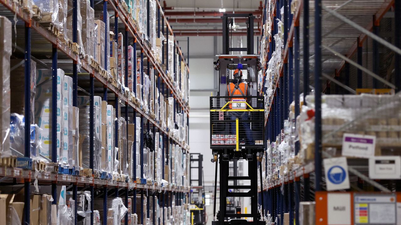 An employee works in a high-bay warehouse at the Amazon logistics centre in Suelzetal near Magdeburg, eastern , on Mai 12, 2021. - The US online sales giant had opened the new warehouse in Saxony-Anhalt in August 2020. (Photo by Ronny Hartmann / AFP) (Photo by RONNY HARTMANN/AFP via Getty Images)