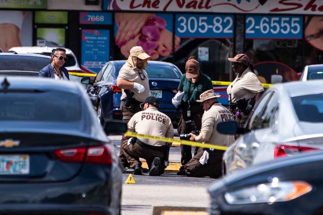 Miami Dade police officers collect evidence at the scene of the May 30, 2021, shooting near Hialeah.