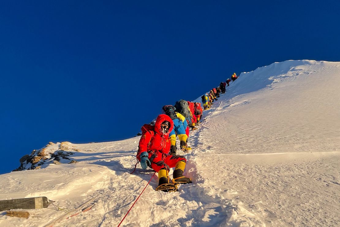 Mountaineers as they climb during their ascend to summit Mount Everest on May 12, 2021.