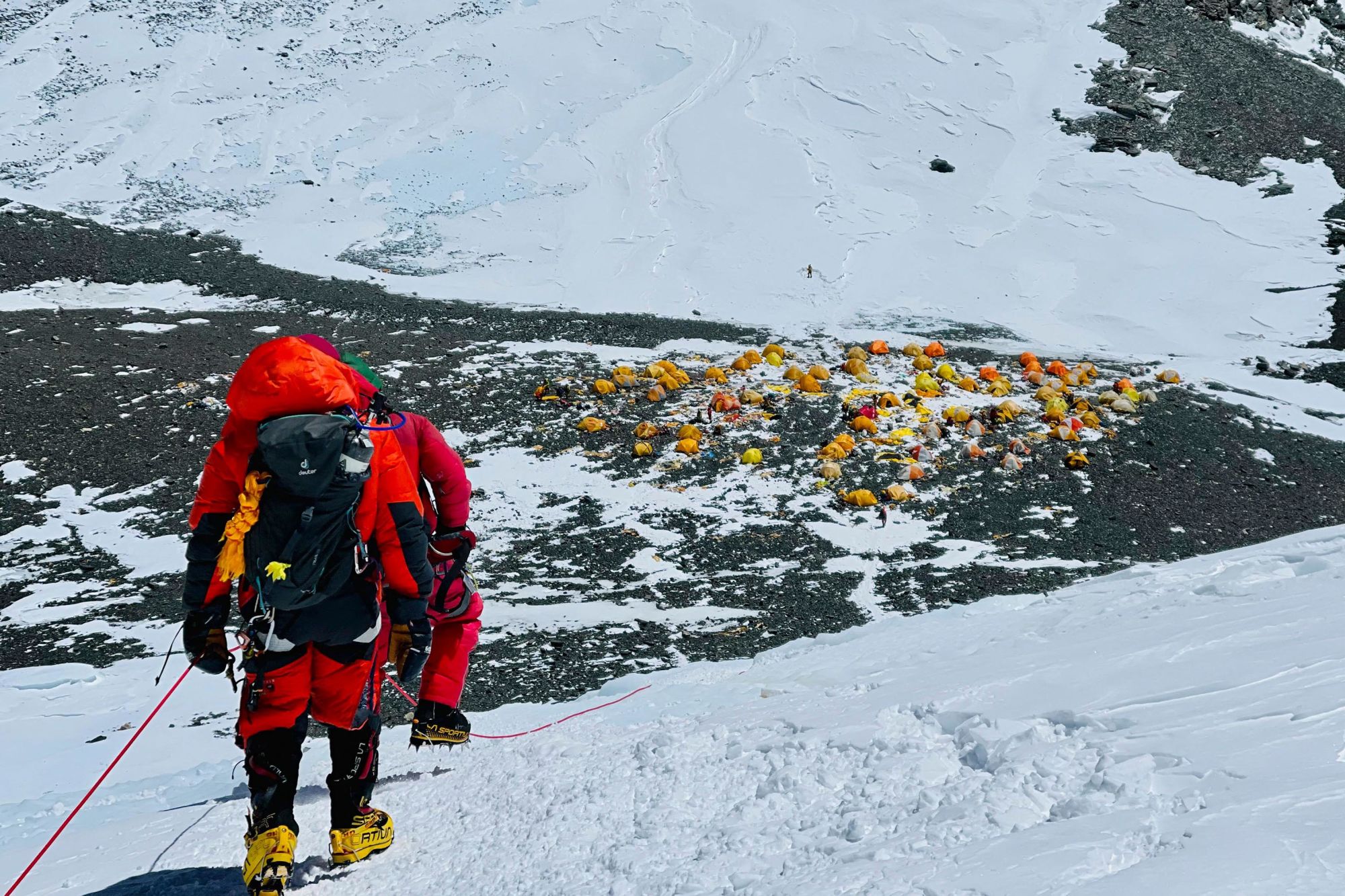 This photograph taken on May 31, 2021 shows mountaineers looking back at Camp 4 during their ascent to the summit of Mount Everest.