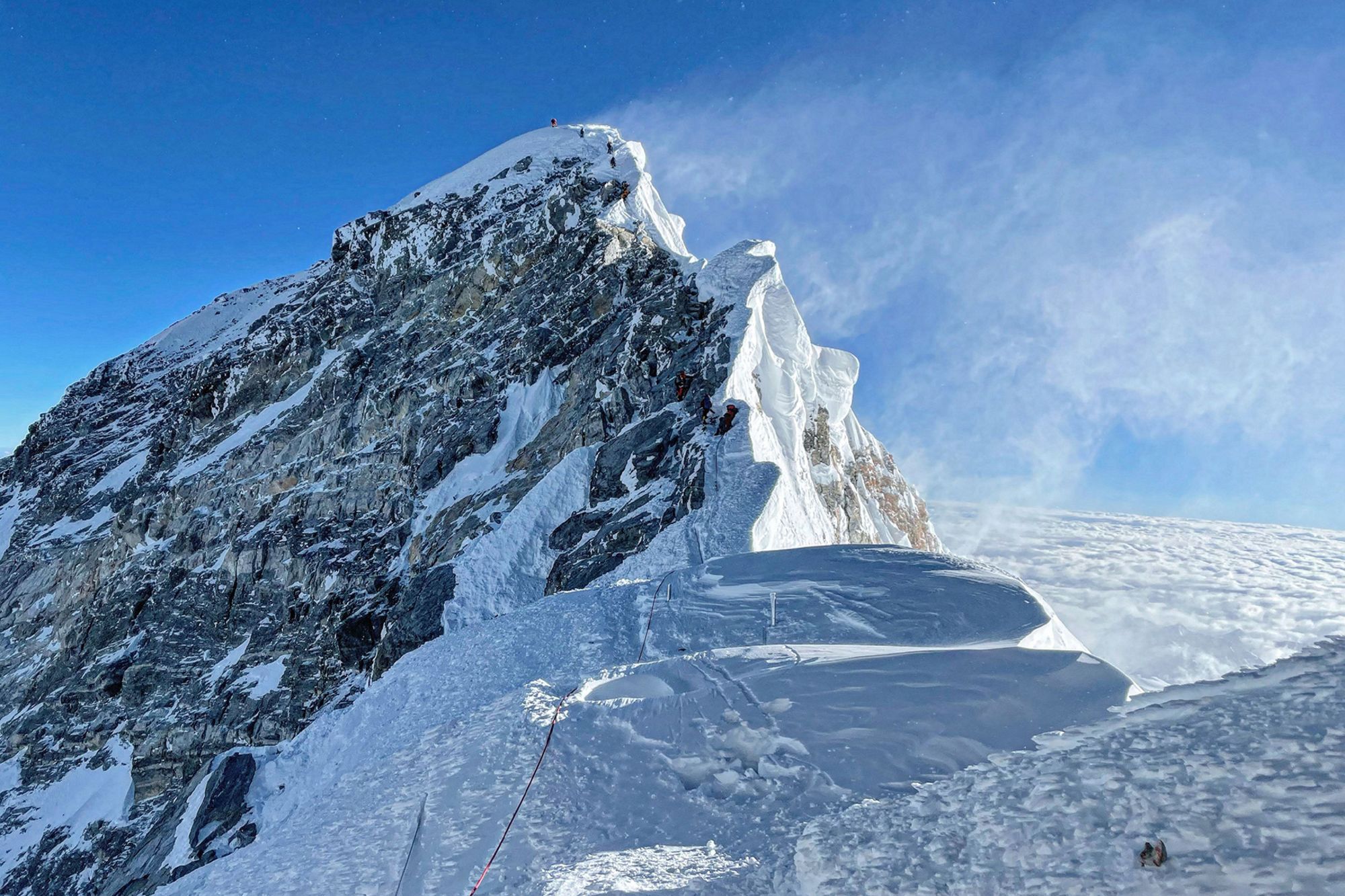 Mountaineers climbing the Hillary Step during their ascend of the South face to summit Mount Everest on May 31, 2021.