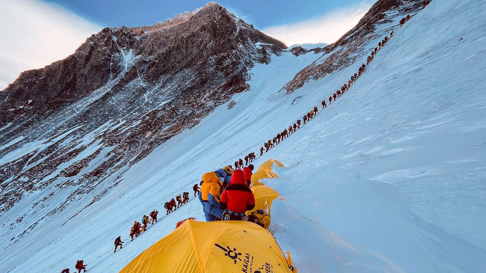 This photograph taken on May 31, 2021 shows mountaineers lined up as they climb a slope during their ascent to summit Mount Everest.