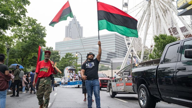 ATLANTA, GA - JUNE 19: People participate in a parade to celebrate Juneteenth on June 19, 2021 in Atlanta, Georgia. Juneteenth marks the end of slavery in the United States and the Juneteenth National Independence Day became the 12th legal federal holiday signed in June 17th, 2021. (Photo by Megan Varner/Getty Images)