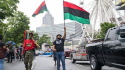 ATLANTA, GA - JUNE 19: People participate in a parade to celebrate Juneteenth on June 19, 2021 in Atlanta, Georgia. Juneteenth marks the end of slavery in the United States and the Juneteenth National Independence Day became the 12th legal federal holiday signed in June 17th, 2021. (Photo by Megan Varner/Getty Images)
