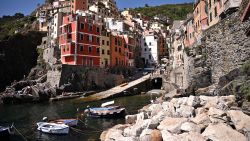 Coloured buildings are seen in the village of Riomaggiore on June 24, 2021, Cinque Terre National Park, near La Spezia, Nortwestern Italy. (Photo by MARCO BERTORELLO / AFP) (Photo by MARCO BERTORELLO/AFP via Getty Images)