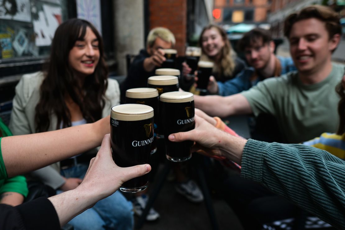 Drinking Guinness outside a pub in Dublin city center.