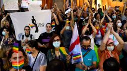 Participants hold rainbow flags during a rally in support of those who were injured during the July 5 protests, when a pride march was disrupted by members of violent groups, in Tbilisi on July 6, 2021. - Thousands rallied in the Georgian capital Tbilisi on Tuesday to denounce attacks targeting  LGBTQ community and journalists that shocked the nation and forced activists to cancel a Pride march. (Photo by Vano Shlamov / AFP) (Photo by VANO SHLAMOV/AFP via Getty Images)