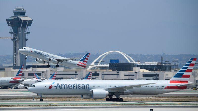 American Airlines plane aborts takeoff at Los Angeles International Airport after cargo jet crosses the runway in front of it