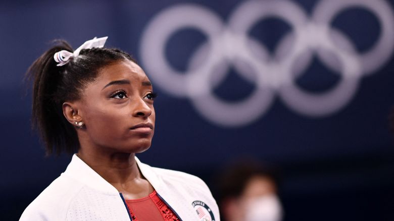 USA's Simone Biles looks on during the artistic gymnastics women's team final during the Tokyo 2020 Olympic Games at the Ariake Gymnastics Centre in Tokyo on July 27, 2021. (Photo by Loic VENANCE / AFP) (Photo by LOIC VENANCE/AFP via Getty Images)