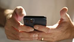 SALT LAKE, UT - AUGUST 04: A person scans and downloads an app to start the process of converting their physical driver license to an official digital version to be stored on a mobile phone at a Harmons Grocery store on August 4, 2021 in Salt Lake City, Utah. Utah is the first state in the nation to start to convert and offer digital driver licenses on mobile devices. (Photo by George Frey/Getty Images)