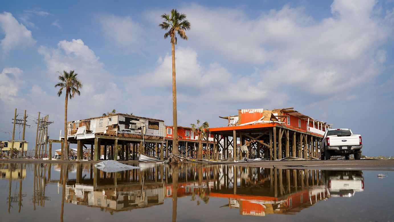 Storm damaged houses in flood water after Hurricane Ida on September 3, 2021 in Grand Isle, Louisiana. The state is particularly vulnerable to sea level rise.