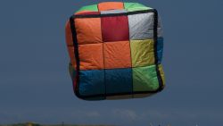 A rubiks cube-shaped kite flies during a kite festival in Hsinchu, northern Taiwan on September 5, 2021. (Photo by Sam Yeh / AFP) (Photo by SAM YEH/AFP via Getty Images)